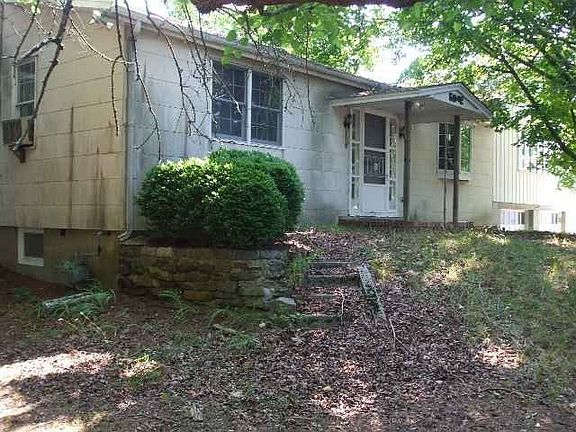 Clean up the yard for a pretty treed setting...