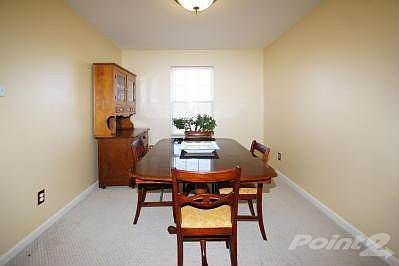 Formal Dining Room has overhead lighting and access to the kitchen.