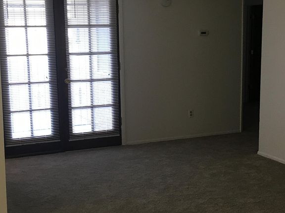 French doors to low care fenced backyard 