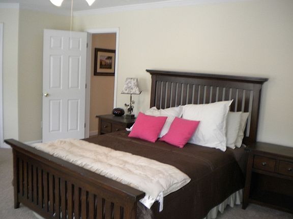 guest bedroom with large closet and private bath