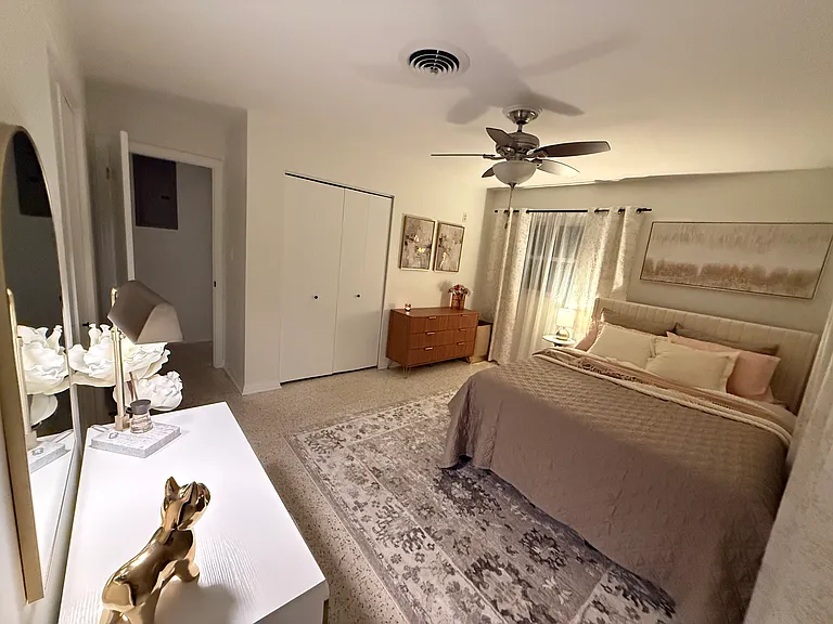 Master bedroom with en suite, two closets, chester drawers and makeup table/desk.