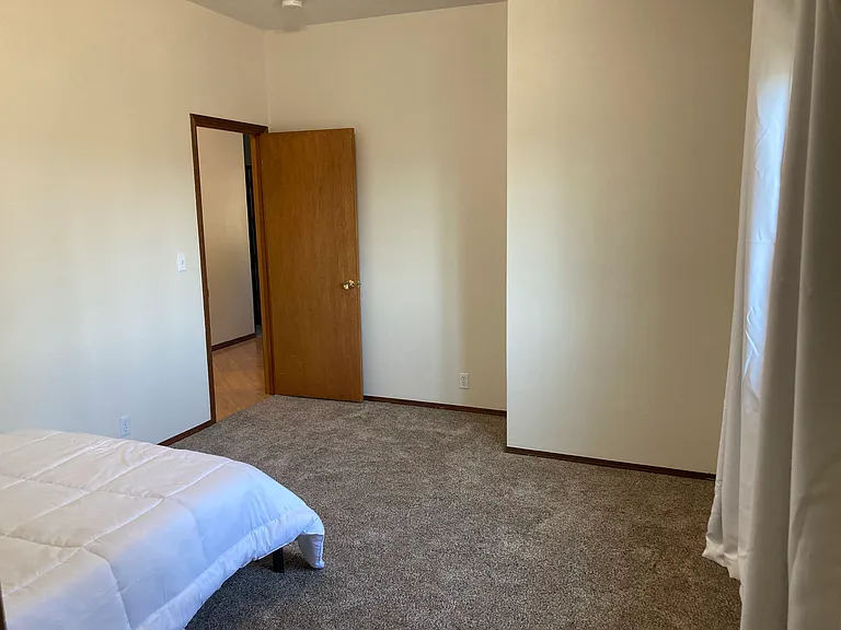 Large room, fresh paint, new carpet. Double windows and black out curtains.