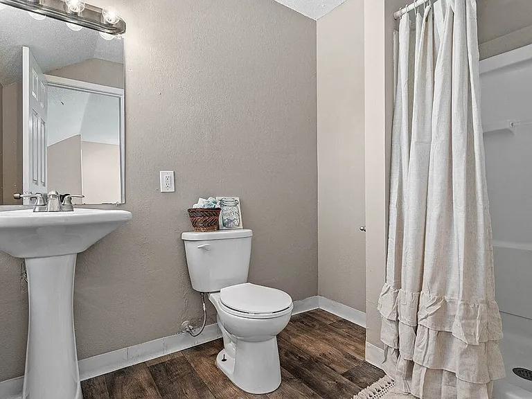 Bathroom with Wood Plank Style Flooring