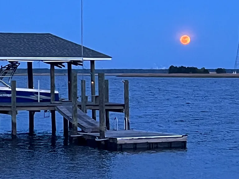A neighbors dock and a moonrise on the river.