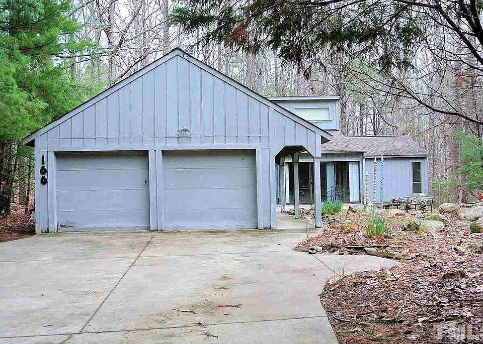 Front View, cement driveway and spacious 2 car garage