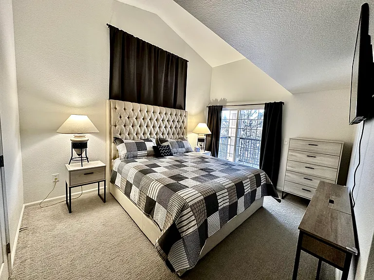 Master bedroom. King size bed, walk- in closet, TV, balcony.