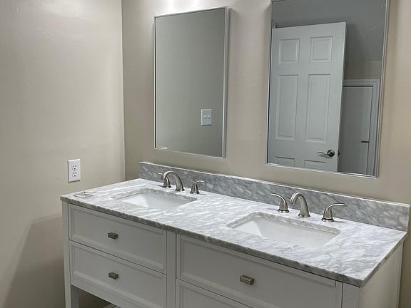Master bath vanity next to wall in closet.