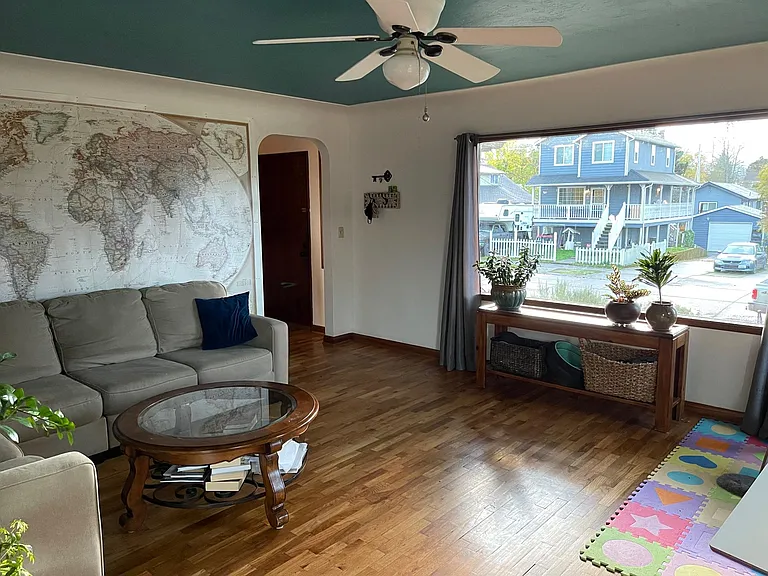 Coved plaster ceilings and restored hardwood floors.