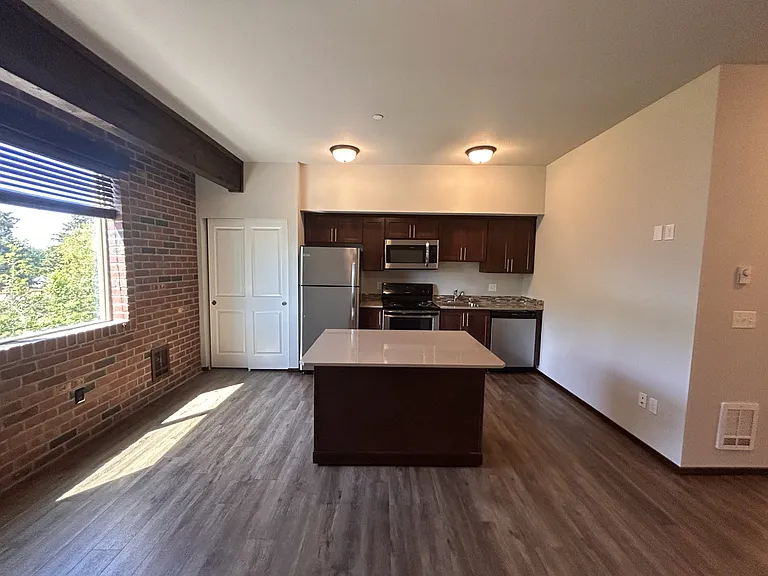 all studio have full kitchen, with stainless steel appliances & moving floating island and adorable brick wall