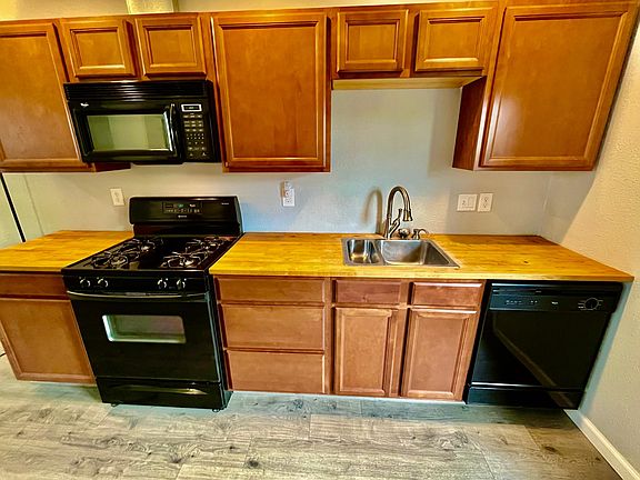Lots of cabinets, dishwasher, microwave over range