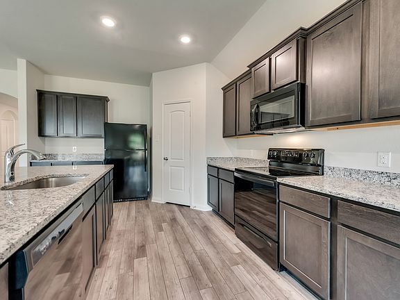 The kitchen comes with a full suite of energy-efficient appliances.