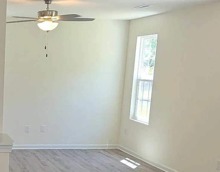 Dedicated dining area conveniently located adjacent to the kitchen, perfect for family meals, entertaining, and special gatherings.