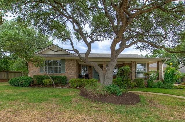 Fabulous curb appeal, open front porch for quiet enjoyment and plenty of shade trees.