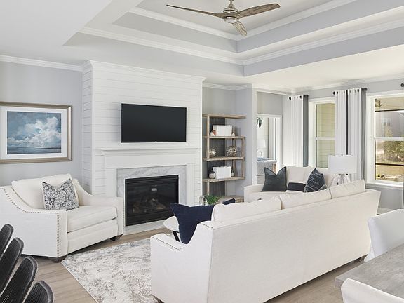 Get cozy near at the optional fireplace in the Gathering Room with a tray ceiling.