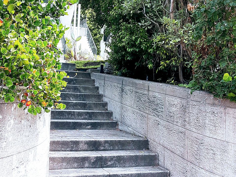 Rustic stone steps set the building off from the street