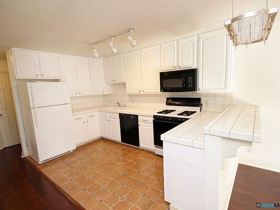 Bright and Open Kitchen with Gas Stove and Dishwasher