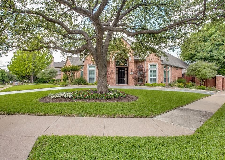 Welcome to 1421 Chesapeake Drive! Magnificent mature trees and professional landscaping enhance the lovely curb appeal of this custom home.