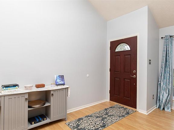 As you enter the home you find a charming entry with a high ceiling and beautiful wood floors.