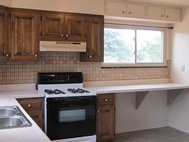 The kitchen has plenty of natural light. All appliances stay