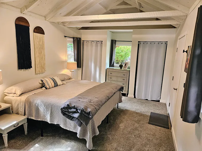 Large bedroom with King bed and lots of storage