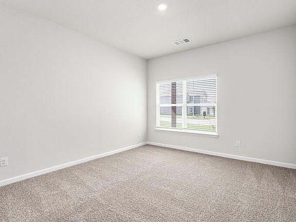 The master bedroom has a large window that lets in great, natural light.