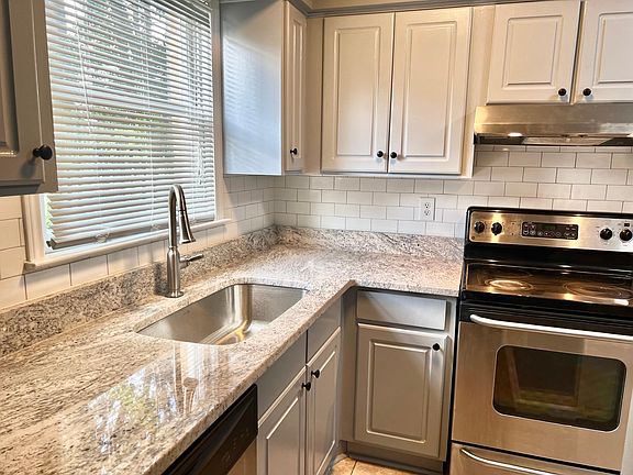Fully Updated Kitchen with Granite Countertops, Stainless Steel Appliances and Tile Backsplash