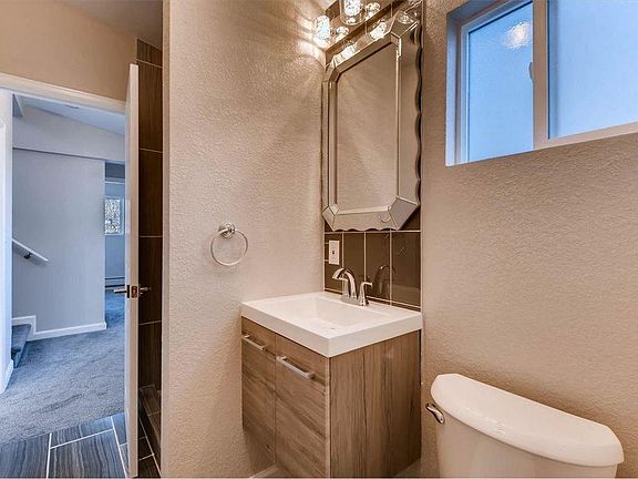 downstairs guest bath w/ stall shower - washer dryer in back of this bathroom