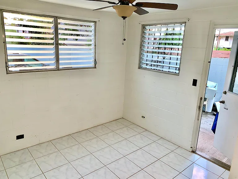 View of bedroom to the back door exit to porch