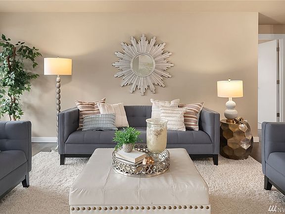 Great open concept living room/kitchen with original refinished hardwoods