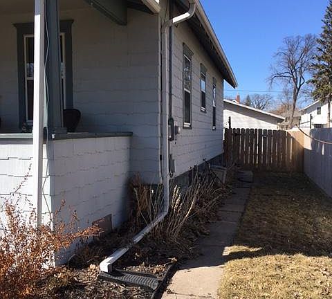 Looking down the north side to the back yard / garage area.