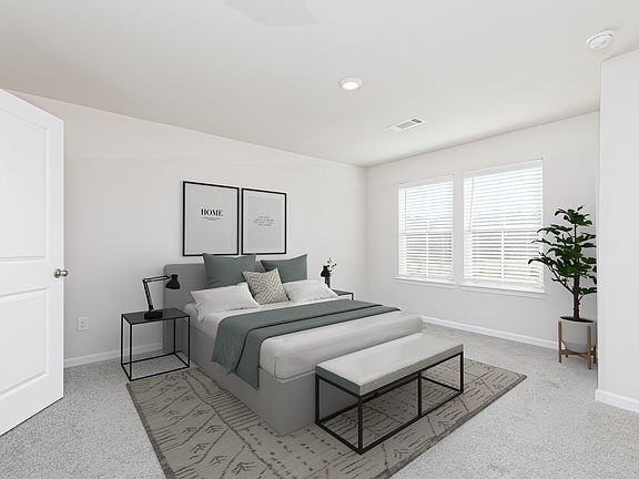 The master suite has a large bedroom, ensuite bathroom, and walk-in closet.
