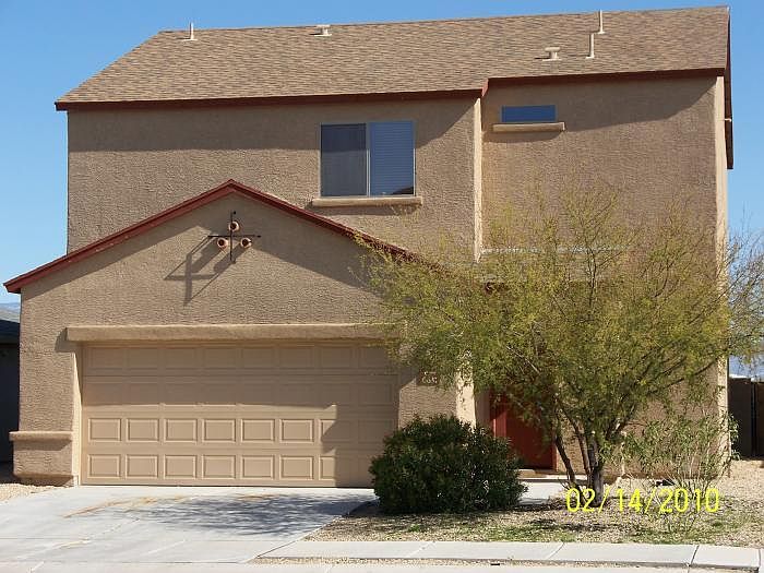 Front of House with easy care yard