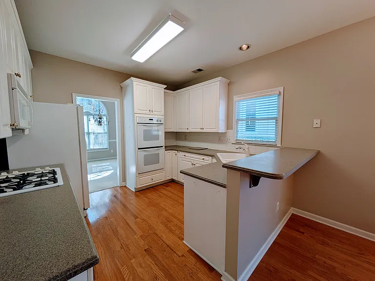 Kitchen, Breakfast Room with View to Dining Rm and Backyard, Laundry and Pantry behind
