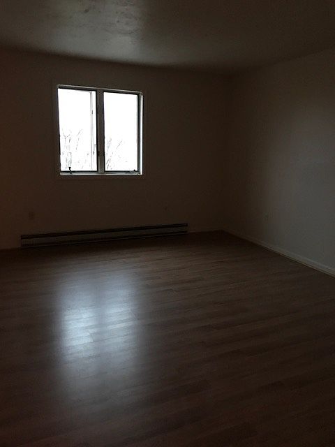 Second bedroom. Cloudy evening.All walls are cream color.