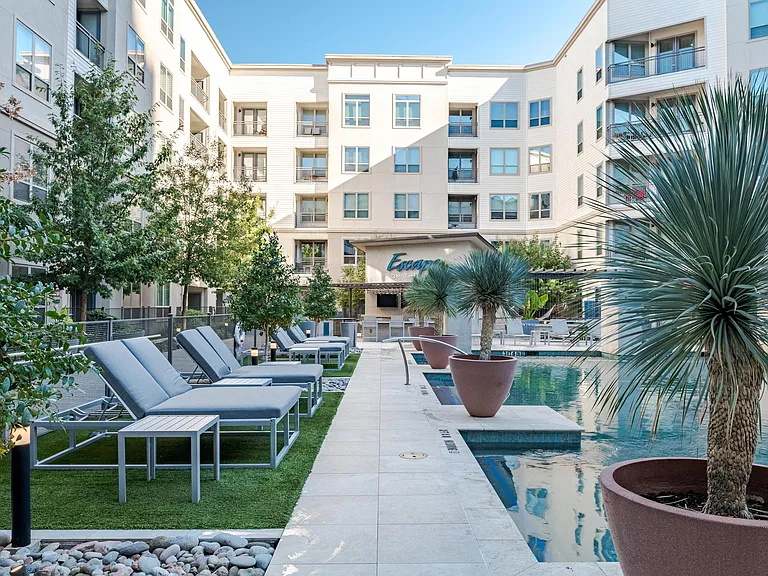 Poolside Sundeck with Lounge Chairs and Modern Landscaping Features