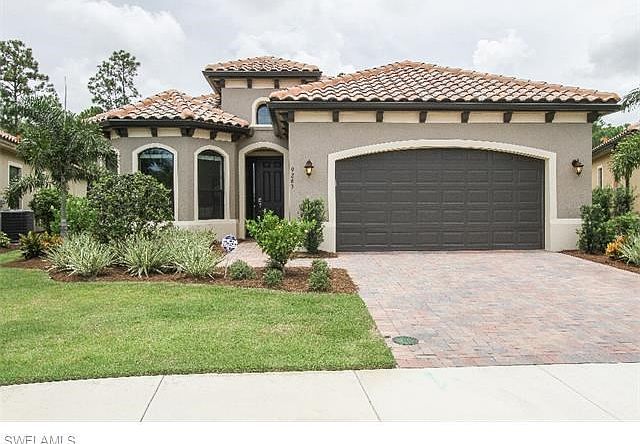Beautiful Meditteranean style exterior with tile roof.