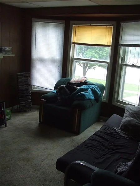 Second floor living room with a nice bay window.