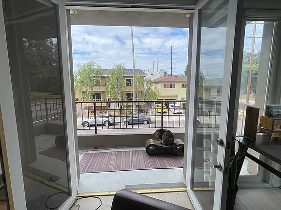 View out to the front west-facing patio (cat not included). Great for sunset!