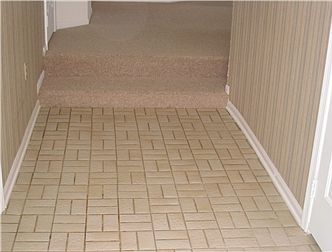 Entry hall w/laid tile, two steps up to great room