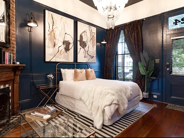 Inside your sanctuary where light floods the bedroom during the day on the color drenched interiors