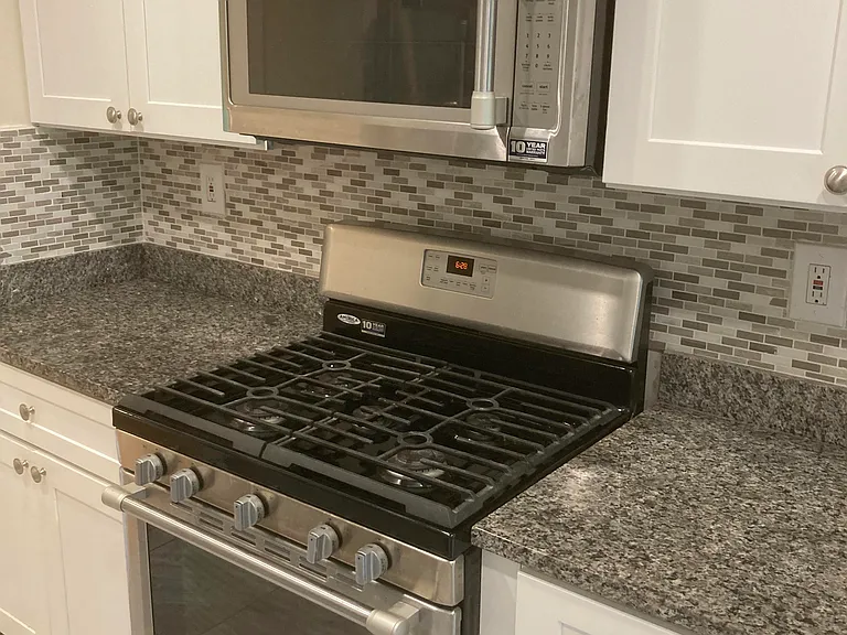 Microwave, range and gas stove.