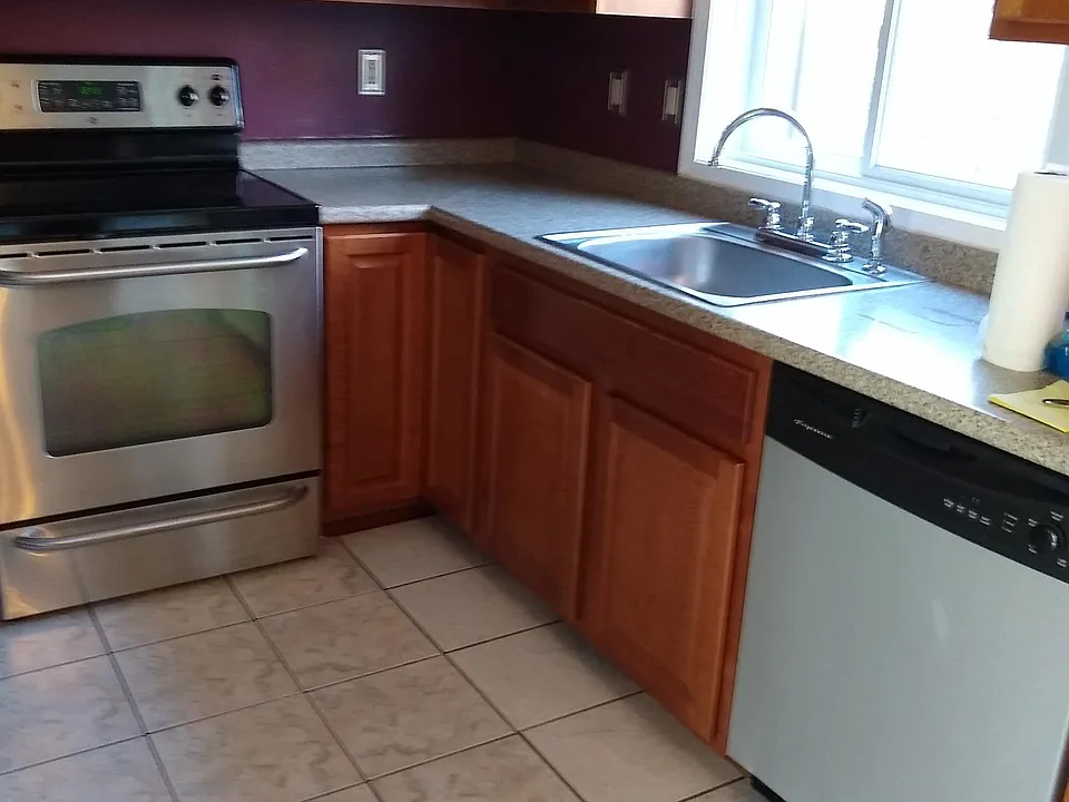 Kitchen with tiled flooring