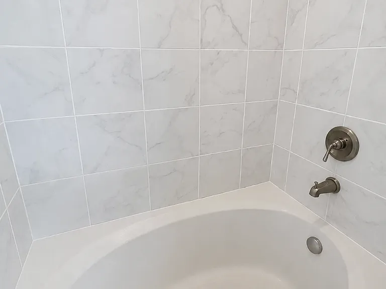 Primary bathroom shower and tub