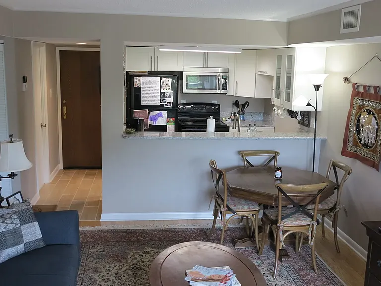 Photo from one of the previous tenant or previous owner to show potential different layout with dining room table
