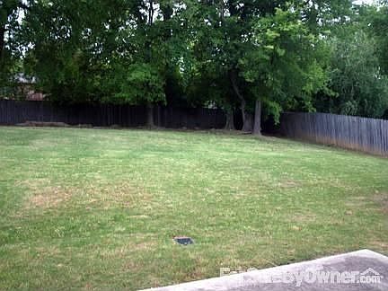 Large wood-fenced backyard