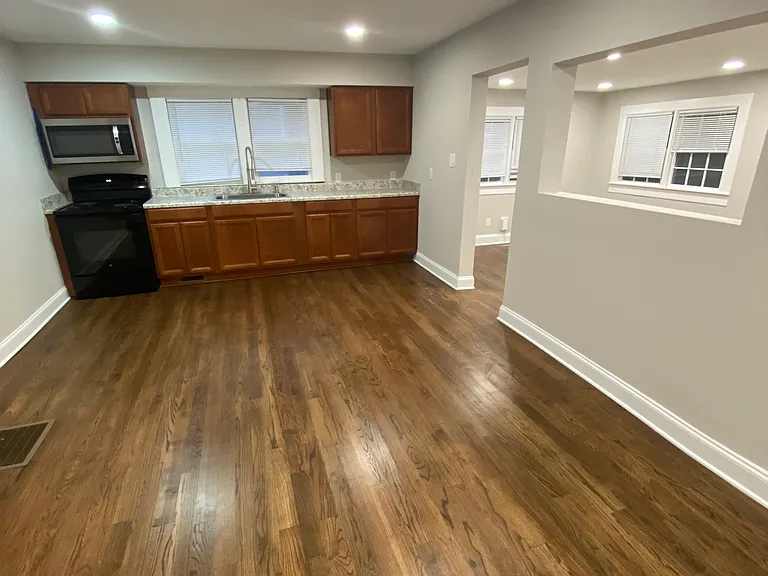 Picture looking from primary enterance door into the kitchen and living room.