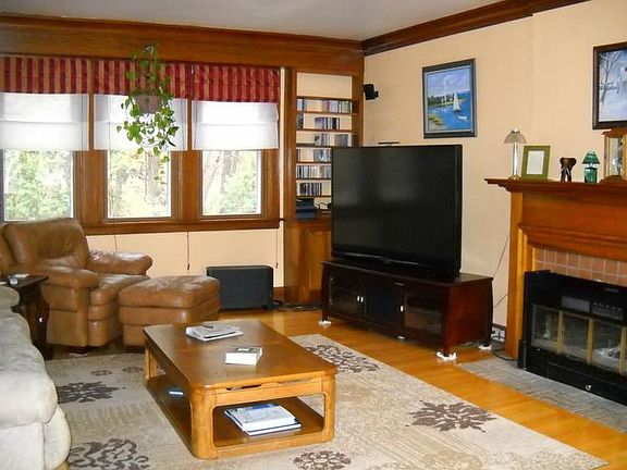 Living Room w/wood burning fireplace.