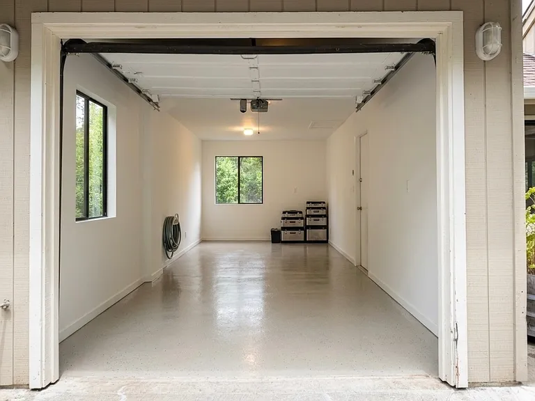Single car garage (or work-room) . Pull-down door. Garage opens to dining area/kitchen (door to right).