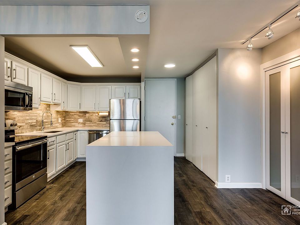 Open kitchen with quartz counters and brand new appliances