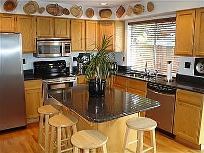 Granite slab countertops, Stainless steel Energystar appliances.